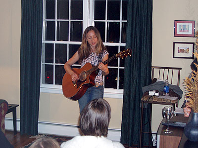 Kyler playing her guitar